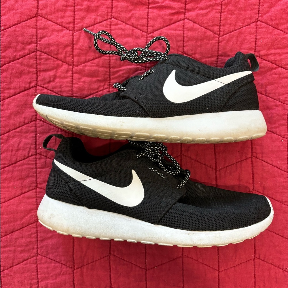 Nike black and white running training shoes. Size 10.